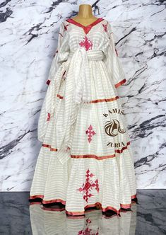 Beautiful Ethiopian and Eritrean Habeshan Dress. Stylish Menen, 100% Cotton We recommend hand washing and air drying to make it last longer. A low heating iron will also keep design and look. Beautiful Habeshan Dress |Ethiopian Traditional Dress|Eritrean Dress|Habesha Kemis|Zuria|Habesha Chiffon|Kemis Eid Anarkali Dress With Long Skirt, Pink Traditional Drape Dress For Spring, Traditional Pink Dress For Spring, Pink Spring Dress With Traditional Drape, Bohemian Long Skirt Dresses For Navratri, White Maxi Dress For Navratri Traditional Ceremonies, White Maxi Dress For Navratri Ceremonies, Traditional White Maxi Dress For Navratri, White Traditional Drape Maxi Dress For Eid