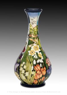 a colorful vase with flowers painted on it