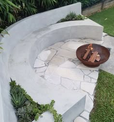 a fire pit in the middle of a garden