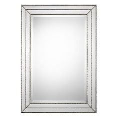 a silver framed mirror on a white wall with beaded border around the edges and bottom edge