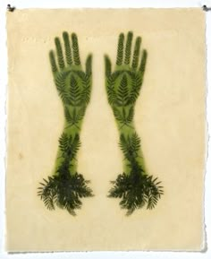 two hands with plants painted on them