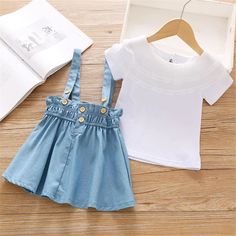 قميص علوي سادة بأكمام قصيرة وتنورة بحمالات للفتيات الصغيرات - PrettyKid Strap Skirt, Toddler Girl Shorts, Childrens Clothing Boutique, Kids Boutique Clothing, Ruffle Sleeve Dress, Suspender Skirt, Girls Sweet, Newborn Outfits, Solid Tops