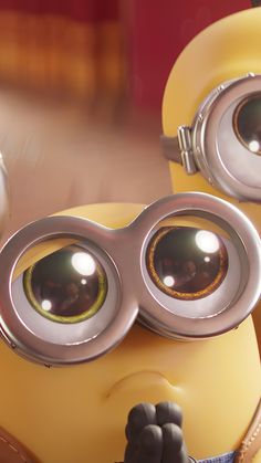 a close up of a minion with big eyes