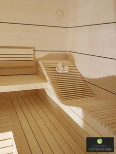 the inside of a sauna with wooden flooring