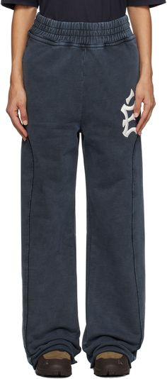 Organic cotton French terry sweatpants. Fading throughout. · Elasticized waistband · Two-pocket styling · Logo embroidered at leg · Panel at outseams Supplier color: Navy