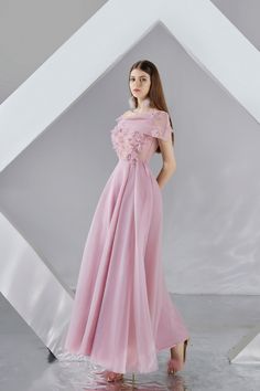 The dress offers a unique look with its cold shoulder sleeves and attached floral applique. The lightweight organza skirt offers a pleated design, creating a chic, elegant evening look. Floral Applique Organza Evening Dress, Wedding Off-shoulder Organza Dress, Organza Evening Dress With Pleated Bodice, Formal Off-shoulder Chiffon Evening Dress, Elegant Organza Dress With Floral Applique, Floral Applique Ball Gown For Evening, Elegant Organza Evening Dress With Floral Applique, Floral Embellished Ball Gown Evening Dress, Evening Ball Gown With Floral Applique