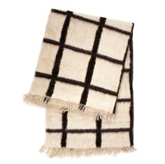 a black and white checkered blanket with fringes