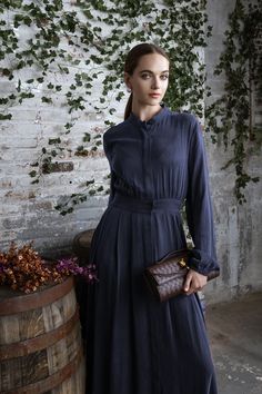 Step into elegance with the Navy Lylah Dress from Mun's AW24-25 collection. Inspired by rich vineyard tones and crafted with luxurious fabrics, this dress combines comfort with timeless charm. Perfect for those looking to dress to impress this fall, whether in business casual settings or a night out. Get ready to elevate your wardrobe this season! #DressToImpress #AutumnFits #WomensFashion #BusinessCasual #FallFashion2024Women #FallOutfits2024 #FallOutfitsWomen #FallFashion 🍂👗 Chic Silk A-line Dress For Work, Fall A-line Midi Dress With Pleated Sleeves, Chic A-line Dress With Pleated Waist, Elegant A-line Maxi Dress In Rayon, Fitted A-line Rayon Dress, Elegant Fall Midi Dress With Pleated Waist, Chic A-line Dress With Pleated Sleeves, Formal Feminine Midi Dress In Viscose, Feminine Formal Viscose Midi Dress