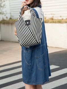 Introducing our Versatile Striped Crochet Tote Bag, the perfect companion for your everyday activities! Featuring a stylish design and sturdy construction, this bag is both fashionable and functional. With its spacious interior and durable straps, you can confidently carry all your essentials wherever you go. Upgrade your daily routine with this must-have bag! Color : Black and White Magnetic : No Bag Size : Mini Style : Casual Type : Crochet Bags Closure Type : Buckle Strap Type : Double Handle Casual Handheld Bag For Day Out, Daily Use Canvas Tote Bag With Single Shoulder Strap, Casual Large Capacity Crochet Bag For Everyday, Spring Shoulder Bag With Single Strap For Everyday Use, Large Capacity Crochet Bag For Spring Day Out, Casual Everyday Straw Bag With Removable Pouch, Casual Daily Use Bucket Bag With Single Shoulder Strap, Versatile Everyday Beach Bag With Adjustable Strap, Casual Straw Satchel Bag For Everyday Use