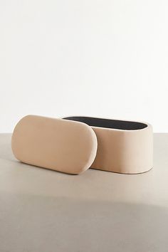 two bowls sitting on top of a table next to each other