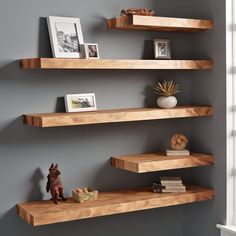 10 FAQs About Floating Shelves Q: "What makes floating wooden shelves a great addition to home decor?" A: Floating wooden shelves provide a versatile and stylish solution for home decor by offering functional storage without sacrificing aesthetics. They can showcase decor items, books, and collectibles, enhancing the overall look of any room.  Q: "How can white floating shelves contribute to a clean and stylish interior?" A: White floating shelves contribute to a clean and stylish interior by adding a sense of lightness and simplicity. They create a neutral backdrop for displaying colorful items, making the space visually appealing.  Q: "In what ways can floating bookshelves be utilized for both storage and display purposes?" A: Floating bookshelves are excellent for storage and display. T Floating Shelves For Corner Wall, Thick Wood Shelves Living Room, Floating Shelves For Toys, Floating Wood Shelves Office, Reclaimed Wood Floating Shelves Bedroom, Wall Book Display Ideas, Modern Bedroom Shelving, Wall Shelves Living Room Decor, Floating Shelves Angled Wall