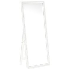 a white mirror sitting on top of a table