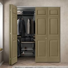 an open door to a closet with clothes on hangers