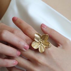 - Handmade golden flower open ring  - Chunky design perfect for making a statement - Ideal for adding a touch of summer/fall to any outfit - Floral inspired jewelry to brighten up your look - Created by Mia Meilleur for a unique and stylish accessory - High quality stainless steel with 18K gold plated - the size of the flower is 3cm approximately, and the diameter of the band is 2cm Gold Flower-shaped Ring For Gift, Gold Flower Shaped Ring For Gift, Gold Flower Ring For Wedding, Handmade Gold Flower Ring Nature-inspired, Handmade Gold Flower Ring, Nature-inspired, Handmade Gold Ring With Flower Shape, Gold Flower Open Ring For Gift, Gold Open Flower Ring As Gift, Gold Open Flower Ring Gift