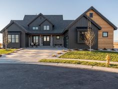 a large house is shown in the middle of an empty lot