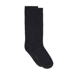 This thick and cozy cable knit slouch sock is warm, comfy, and oversized. | SKIMS Slouch Socks | Black | 6+ | Sock Bar Thick Cable Knit Casual Socks, Thick Casual Cable Knit Socks, Comfortable Ribbed Cozy Socks, Comfortable Cable Knit Winter Socks, Comfortable Cozy Ribbed Socks, Cozy Winter Socks With Ribbed Cuffs, Cozy Black Socks For Cold Weather, Cozy Ribbed Socks, Cozy Solid Color Knee-high Socks