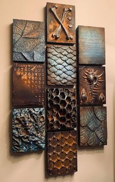 a wall sculpture made out of different types of metal