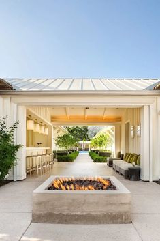 an outdoor fire pit in the middle of a patio