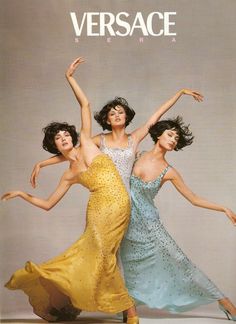 three women in dresses are dancing together on the cover of versa magazine, with one woman holding her arms up