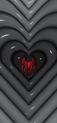 a heart shaped object with a spiderman symbol on it's center surrounded by other shapes