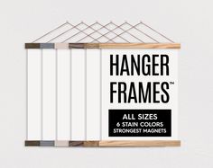 the hanger frames are made from wood and have strings attached to them with magnets