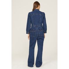 Blue denim (99% Cotton, 1% Elastane). Jumpsuit. Long sleeves. Collar. Front button closure. 32" inseam. 12" rise. Imported. Fitted Cotton Utility Denim Jumpsuit, Fitted Cotton Denim Utility Jumpsuit, Denim Workwear Jumpsuit With Buttoned Pockets, Denim Overall Jumpsuit With Buttoned Pockets For Work, Fitted Denim Jumpsuit With Button Closure, Fitted Denim Jumpsuit With Pockets And Straight Leg, Fitted Medium Wash Overalls With Pockets, Fitted Overalls With Pockets In Medium Wash, Fitted Denim Jumpsuit With Pockets