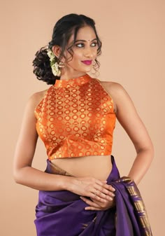 Created with meticulous attention to detail, this pure Kanjivaram silk brocade blouse in Sunset orange is sure to add oodles of gorgeousness to any saree ensemble, especially sharply contrasting ones! Need minor customizations such as altering the sleeve length or neckline? Or if you are looking for a custom size. Ask us and we will try our best to make it happen! SIZE GUIDE : To determine your blouse size, please measure around the fullest part of your bust line using a measuring tape. Your bus Orange Silk Choli With Cutdana, Bollywood Banarasi Silk Blouse With Meenakari, Festive Blouse With Meenakari And Traditional Drape, Traditional Drape Blouse With Meenakari For Diwali, Orange Blouse Piece For Puja During Navratri, Festive Meenakari Art Silk Blouse, Diwali Orange Art Silk Blouse, Festive Orange Art Silk Blouse, Elegant Orange Choli For Diwali