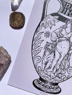 an image of a vase with a woman and tiger on it next to some rocks