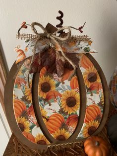 a pumpkin sitting on top of a wooden table