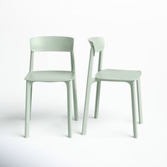 two green chairs sitting next to each other