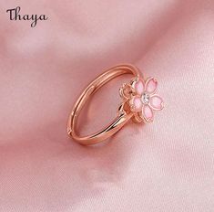 Capture the essence of cherry blossom season with our Silver Sakura Spinner Ring. This elegant piece tells a story of beauty and renewal, as delicate petals bloom and dance in the breeze. The spinner design allows for a soothing sensation, perfect for those seeking balance and serenity in their daily lives. Elevate your style with this stunning symbol of hope and new beginnings.   - Brand: Thaya  - Material: S925 Silver  - Weight : About 2.34g  - Size: Stack Mouth 14th  - Style: Flower  - Gender: Women Cherry Blossom Ring, Blossom Season, Cherry Blossom Season, Hope Symbol, Spinner Ring, Spinner Rings, Cherry Blossom, 925 Silver, Blossom