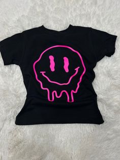 Melting smiley face. Toddler shirts Cute Pink Smiley Face Top, Playful Black T-shirt For Spring, Fun Cotton Tops With Smiley Face, Fun Cotton Top With Smiley Face, Fun Pink Smiley Face Tops, Fun Pink Tops With Smiley Face, Spring Smiley Face Crew Neck Top, Summer Smiley Face Tops For Streetwear, Summer Streetwear Tops With Smiley Face