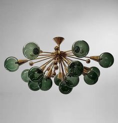 a green chandelier hanging from the ceiling