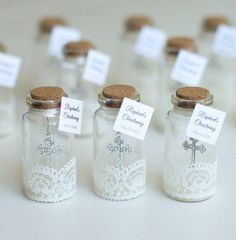 small glass jars with tiny labels on them