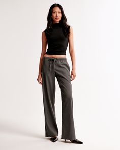 Mid rise, wide leg pants in our everyday menswear fabric, featuring functional pockets and a pull-on style elasticated waistband with a drawstring detail for comfort and adjustability. The body of this garment contains 66% recycled polyester. Menswear Women, Dressy Jeans, Womens Wide Leg Pants, Shop Jeans, Suit Accessories, Pull On Pants, New Arrival Dress, American Apparel, Bottoms Pants