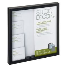 the black frame holds three cards and two envelopes, which are folded in white paper