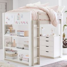 a white bunk bed with drawers underneath it