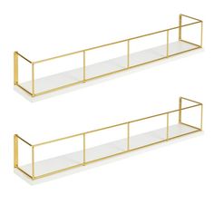 two gold metal shelves with glass shelves on each side, one is empty and the other has