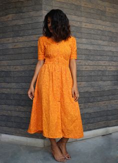 "Orange hand block print maxi dress, Button down dress, Custom made, Made to order, Plus size This linen dress is perfect for the ongoing Autumn. -Model height: 5'3\" wearing size S -Length: 46\" -Fit: Comfortable -100% Cotton Hand block printing is one of the oldest techniques used in India. **Note: Free Shipping time 15-21 days. Express Shipping time 5-7 days.**" Yellow Cotton Button-up Dress, Yellow Button-up Cotton Dress, Cotton Midi Dress With Buttons For Casual Wear, Bohemian Cotton Button-up Dresses, Orange Cotton Dresses With Printed Motifs, Orange Anarkali Dress With Printed Motifs, Block Print Fitted Maxi Dress, Orange Cotton Sundress Maxi Dress, Bohemian Cotton Midi Dress With Buttons