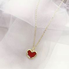 Cute Red Heart Necklace In Gold The Cutest Golden Necklace With Red/ Ruby Heart And Gold Plated Borders. Tags: Heart Necklace, Red Heart Necklace, Ruby Heart Necklace, Crimson Heart Necklace, Gold Necklace With Red Hearts, Red Heart Golden Pendant, Gold Pendant, #Redheartnecklace #Goldjewelry #Goldnecklace #Heartnecklace #Goldheartnecklace Red Clavicle Chain Jewelry For Valentine's Day, Trendy Open Heart Necklace For Valentine's Day, Red Heart Necklace With Clavicle Chain, Trendy Red Heart Necklace For Valentine's Day, Red Clavicle Chain Necklace For Valentine's Day, Red Heart Clavicle Chain Necklace, Trendy Heart Print Necklace For Valentine's Day, Red Heart Cut Necklace As Gift For Her, Red Heart-shaped Jewelry For Mother's Day