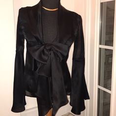 Irresistible Black Sheer Silk. Shawl Color. Low V-Neckline. One Bust-Line Button Fastening Large Bow & Hanging Ribbon Design. Long Sleeves With Dramatic Bell Design. Open Stomach Area. Incredibly Stunning Beautiful Elegant & Sexy. Euc. Made In Italy. No Snags Or Loose Seams. Immaculate Condition. A Conversation Statement. Chic V-neck Party Blazer, Chic Silk Blazer For Night Out, Chic Long Sleeve Blazer For Evening, Sleek Formal Blouse For Fall, Designer V-neck Party Top, Sleek Long Sleeve Blouse For Evening, Elegant Silk Blouse For Date Night, Sleek Long Sleeve Evening Blouse, Silk V-neck Top For Formal Occasions