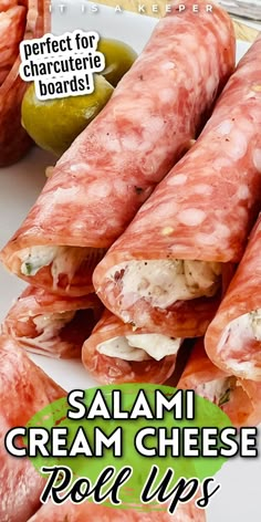 some food is laying out on a plate with the words salami cream cheese roll ups