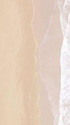 an aerial view of the ocean and beach