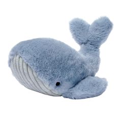 a blue stuffed animal laying on top of a white surface