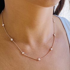 "Our stunning cubic zirconia necklace is the perfect to layer up with your favorite everyday pieces. Featuring eye-catching shiny circular cubic zirconia discs that are stationary evenly spread out on a delicate chain. DETAILS & SIZE *The listing is for one cubic zirconia necklace *Available in 14kt gold,rose gold plating over sterling silver or sterling silver chain and findings *Adjustable length choker will have a 1\" extension chain Lengths: 16\" + 2\" extender *Every purchase comes in a Tan Rose Gold Cubic Zirconia Round Necklace, Rose Gold Cubic Zirconia Necklace, Rose Gold Round Diamond Necklace With Clavicle Chain, Round Cubic Zirconia Diamond Necklace, Delicate Round Cubic Zirconia Necklace, Round Diamond Necklace With Clavicle Chain, Cubic Zirconia Clavicle Chain Diamond Necklace With Round Pendant, Delicate Diamond Clavicle Necklace, Cubic Zirconia Necklace With Adjustable Chain And Round Cut