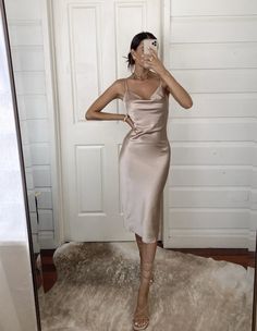 The Aspen Midi Dress in Champagne Satin is the perfect style for an upscale event, be it worn as a wedding guest dress, cocktail party dress or social occasion. -Cowl Neck Midi Satin Slip Dress -Adjustable thin spaghetti strap -Lightweight fabric -Back center leg slit -Slip-On Dress, no zipper -Fabric has slight stretch -Size Tip: Please use the attached size guide for sizing -Polyester satin, cold water hand wash only -Length in size 2 is 44" -Our Model, Briana, is 5'9 wearing a US size 4 -We e Engagement Party Outfit, Engagement Party Dresses, Recruitment Outfits, Champagne Dress, Wedding Attire Guest, Beige Dresses, Silk Midi Dress, Satin Slip Dress, Cowl Neckline