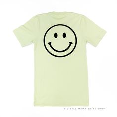 All Little Mama shirts are unisex sizing. They run slightly larger than typical women's shirts and slightly smaller than typical men's shirts.Please reference all size charts before purchasing.The default design color on this shirt is white, unless an option is given. Basic Everyday Pre-shrunk Shirt, Cotton Short Sleeve Top With Smiley Face, Fun Cotton Tops With Smiley Face, Fun Cotton Top With Smiley Face, Casual Smiley Face Top, Cotton Smiley Face T-shirt With Crew Neck, Cotton Smiley Face Crew Neck T-shirt, Green Funny Shirt With Screen Print, Funny Green Shirt With Screen Print