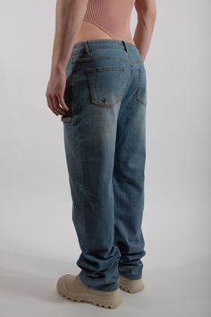 Low-rise and oversized jeans crafted with premium cotton. A relaxed fit that bunches at the bottom. Featuring six pockets: four smock-like pouches at the front and two regular pockets at the back. Style runs large, please size down if between sizes. Machine wash, tumble dry low 70% Cotton, 15% Polyester, 13.8% Viscose Fiber, 1.2% Spandex Medium Wash Recycled Denim Jeans With Side Pockets, Medium Wash Jeans With Side Pockets In Recycled Denim, Medium Wash Recycled Denim Cargo Jeans, Recycled Denim Cargo Jeans With Side Pockets, Everyday Medium Wash Cargo Jeans, Urban Relaxed Fit Jeans With Pockets, Faded Denim Jeans With Side Pockets, Faded Jeans With Side Pockets, Medium Wash Relaxed Fit Jeans With Side Pockets