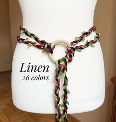 3 strands hand braided belt:  One strand: Linen uncolored braided rope and green leaves trim,  Two strands: Linen yarns / You can Choose the color/ Or your combination of 2 colors (write in message) First photo- Forest green linen Total belt length approx. (from wooden ring to tassel tip) 132/ 152/ 172/ 192 cm -   52"/ 60" /68"/ 76"  Wide approx 1.2-1.5cm /0.5" Viking Women Belt, Traditional Adjustable Hand-tooled Belt, Irish Woven Belt, Medieval Brown Corset Belt For Larp, Crochet Belt, Braided Belt, Linen Yarn, Wood Rings, Suspender Belt