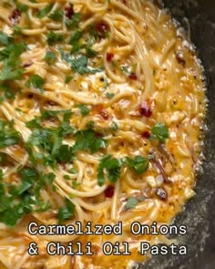 a bowl filled with pasta and garnished onions